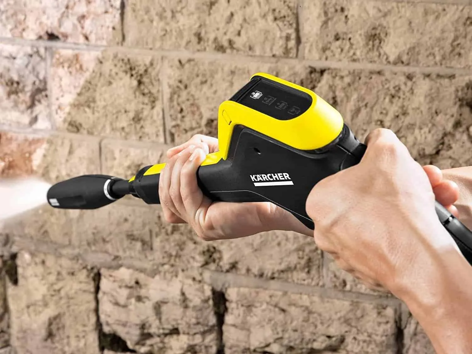 Cleaning masonry wall with a Karcher pressure washer