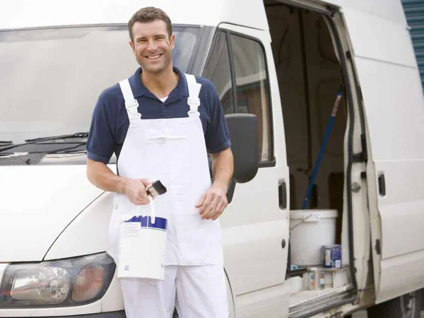 Painter & Decorator stood next to a white van