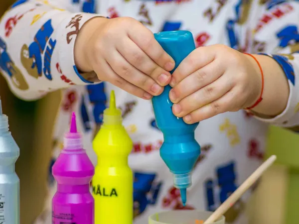 Child playing with paint