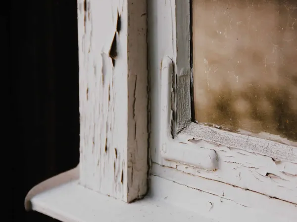 A window with old flaking paint