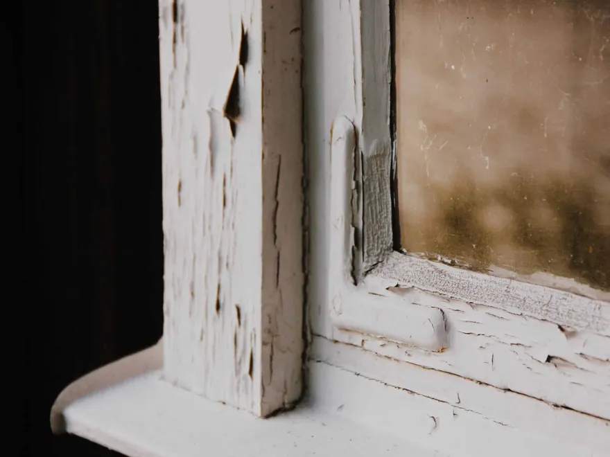 A window with old flaking paint