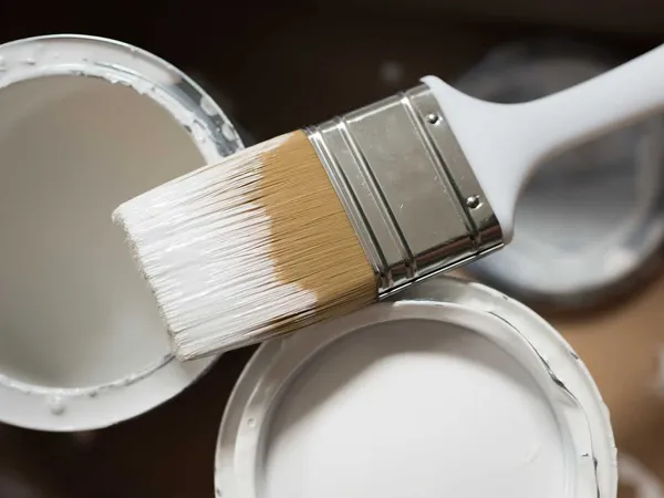 white gloss paint and brush