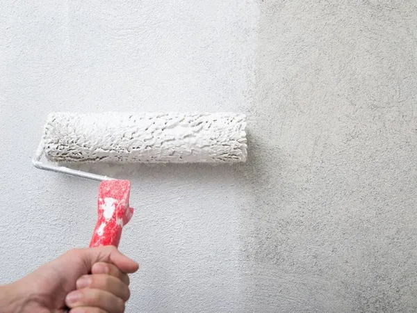 Painting a wall with a roller