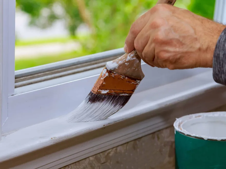 Painting a window ledge with white wood primer
